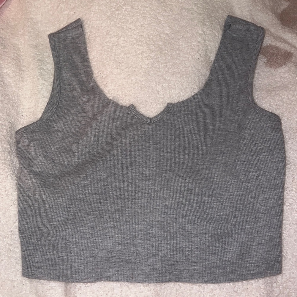 Grey tank with V cut.